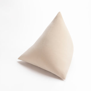 Shop our cream modern throw pillow, the BEIJA. Pyramid-shaped and handmade from the finest velvet and materials by skilled craftspersons in our Manhattan studio.